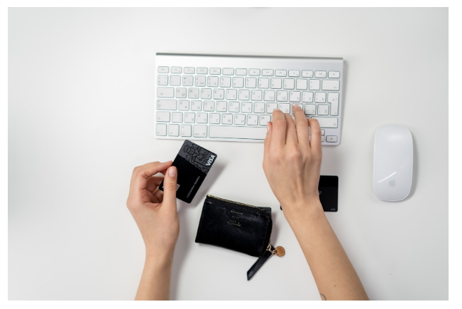 Person with credit card getting ready to make an online purchase