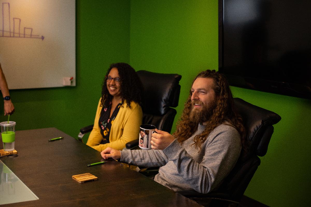 People smiling in a meeting