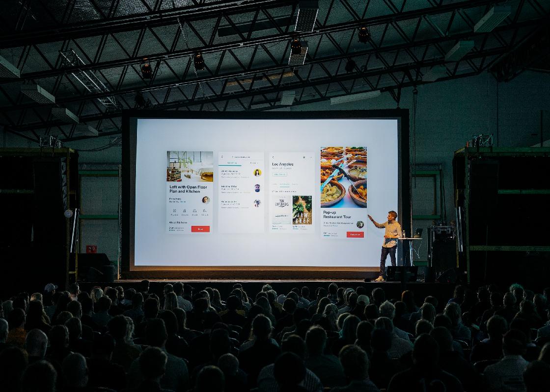 Man giving presentation to a large audience