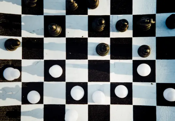 A chess board photographed from above, signifying the importance of an industria