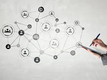 A B2B marketer makes notes on a tablet, looking at how multiple factors impact a