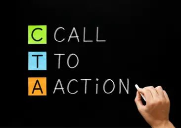 A hand writes with chalk on a blackboard: CTA--Call to Action
