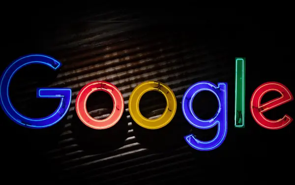 The google logo in rainbow letters and imposed on a black background