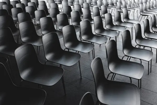 Empty chairs in an auditorium waiting to be filled by the target audience