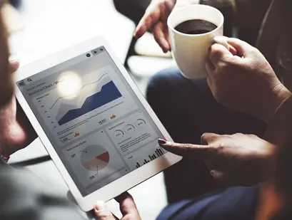 B2B industrial marketers look at data on a tablet to plan a dynamic left navigat